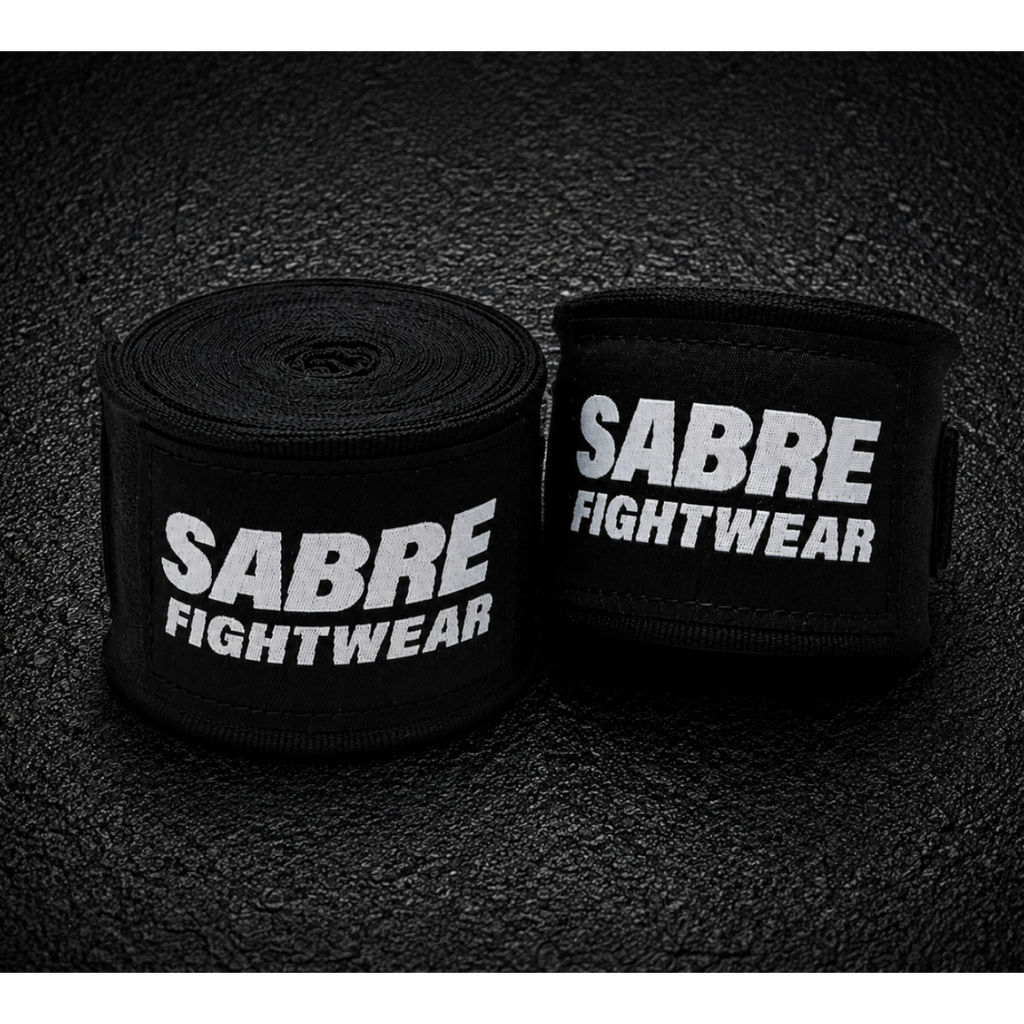 Black boxing hand wraps on a dark textured background