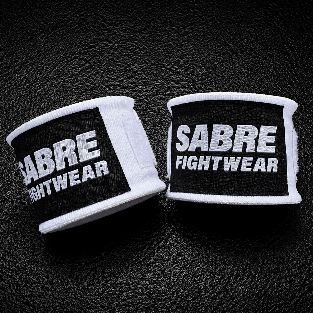 Sabre Fightwear Boxing handwraps on a dark textured background